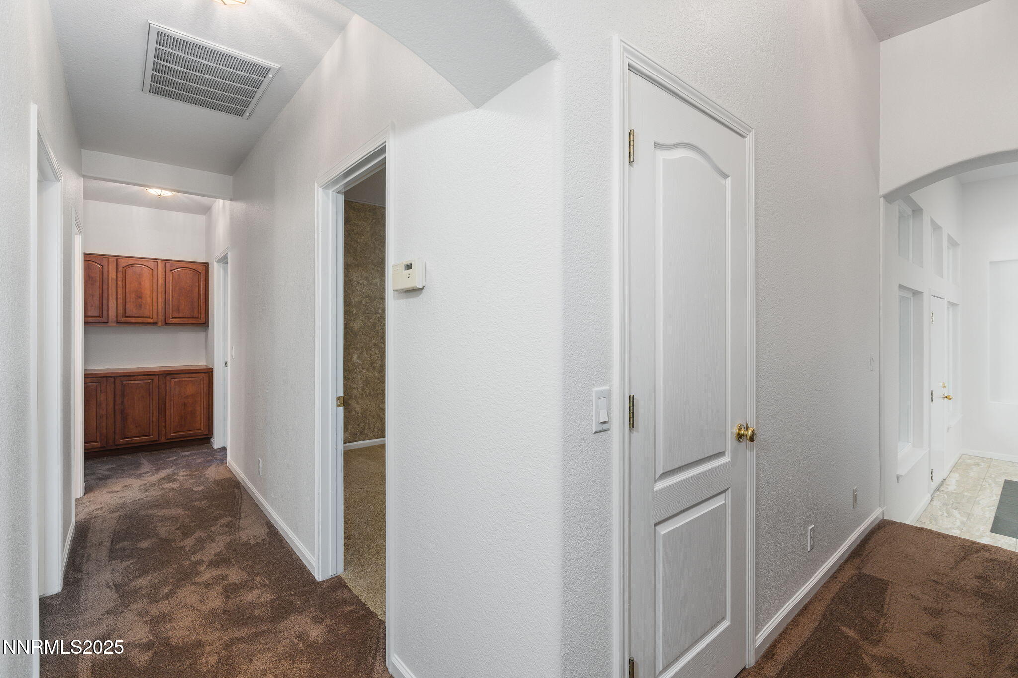 1300 Flanders Road Reno, NV 89511 - Photo 23 of 46 a view of a hallway with a closet and a bathroom