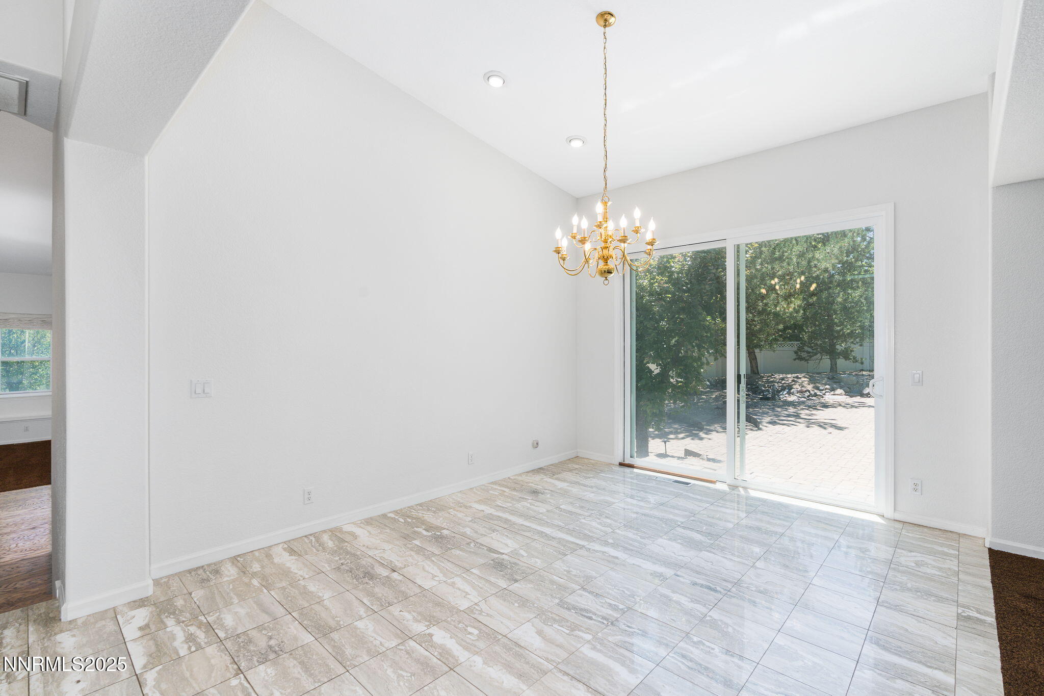 1300 Flanders Road Reno, NV 89511 - Photo 44 of 46 a view of an empty room with chandelier