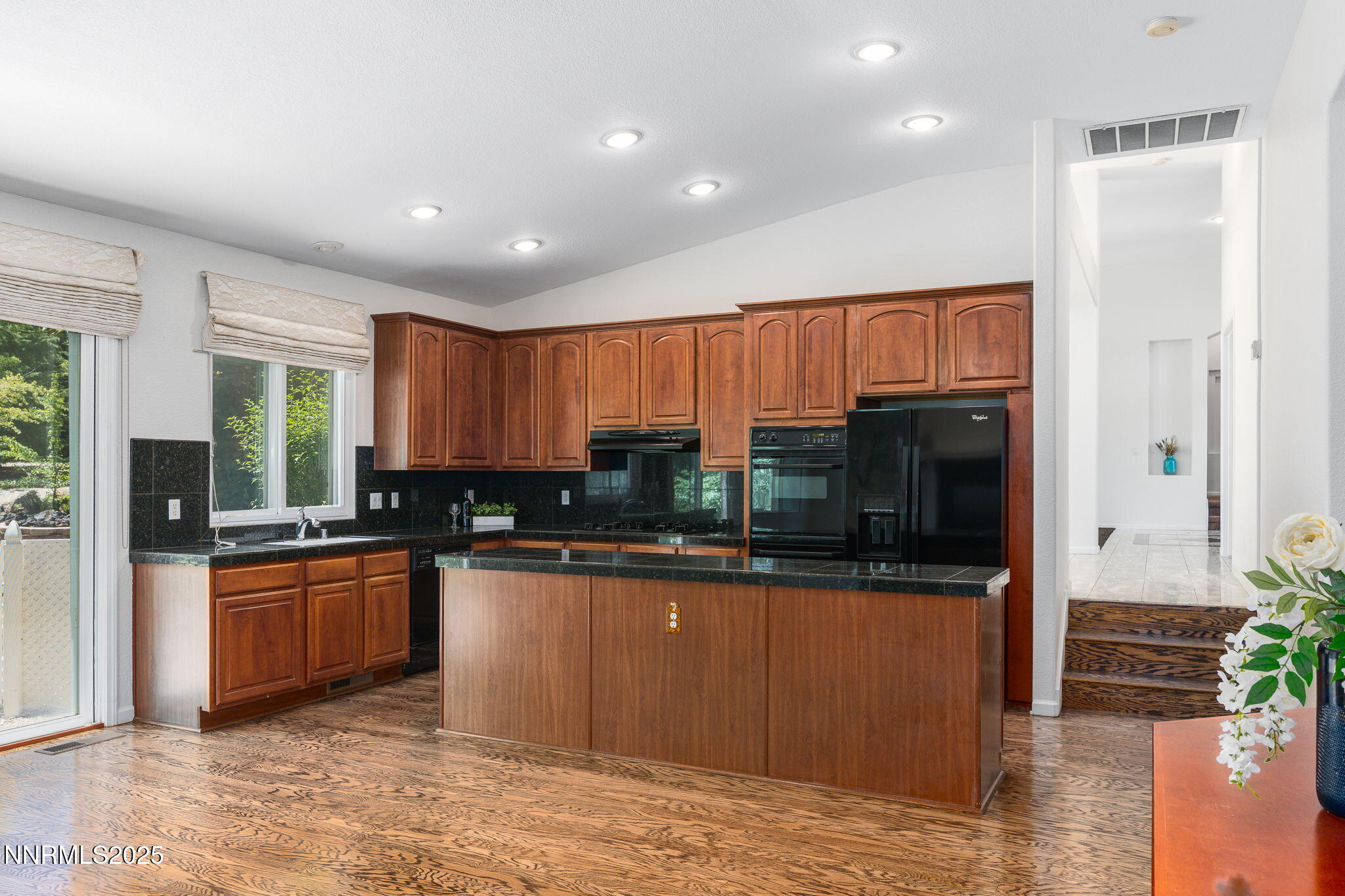 1300 Flanders Road Reno, NV 89511 - Photo 6 of 46 a kitchen with stainless steel appliances granite countertop a refrigerator and a stove top oven