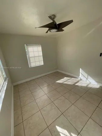 a bathroom with a granite countertop toilet a sink and a bathtub