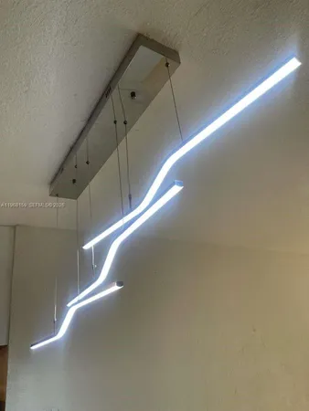 a kitchen with a sink a stove and a refrigerator