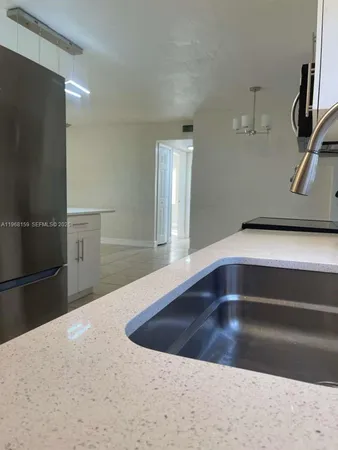 a kitchen with a sink and a cabinets