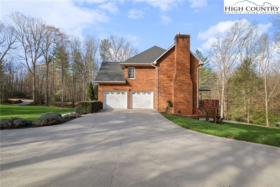 458 Jim Caudill Road Wilkesboro, NC 28697 - Photo 38 of 50 a view of a house with a yard