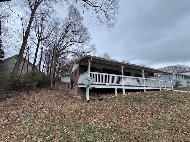 6240 Humphries Hill Road Austell, GA 30106 - Photo 2 of 9 a house is sitting in middle of the forest