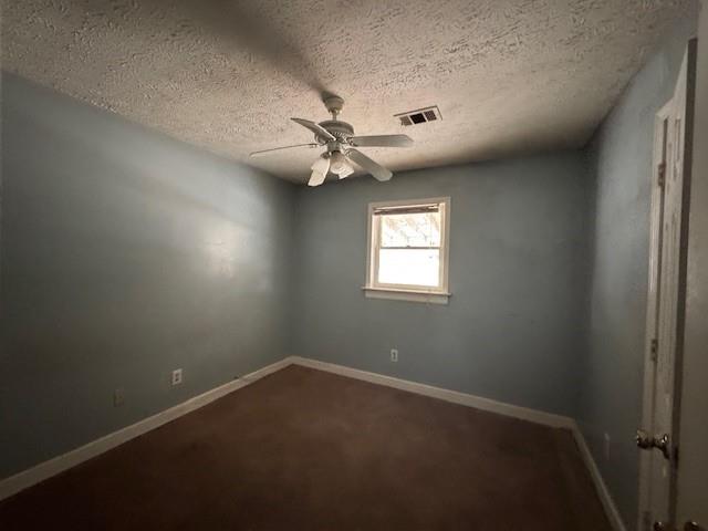 6240 Humphries Hill Road Austell, GA 30106 - Photo 5 of 9 an empty room with a window and a fan