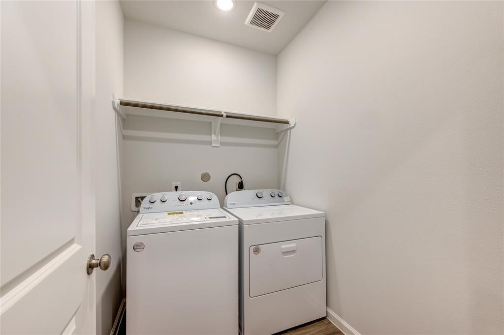 94 Valiant Ridge Trail Magnolia, TX 77354 - Photo 10 of 13 a utility room with dryer and washer