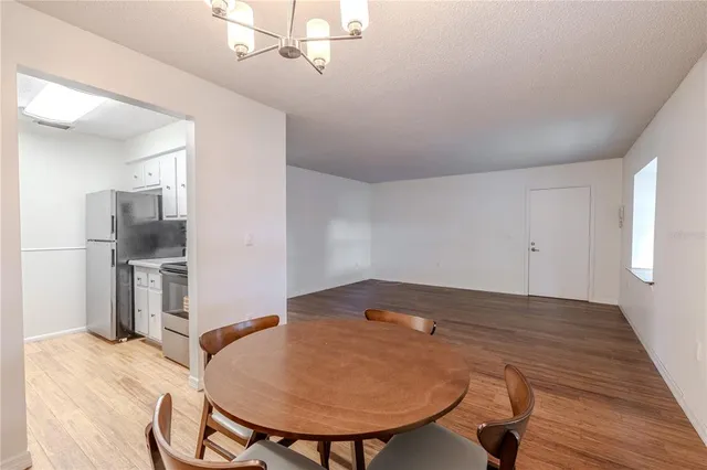 a view of kitchen with furniture and wooden floor
