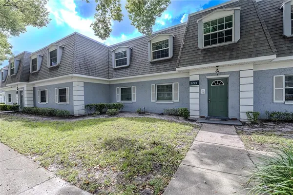 a front view of a house with yard