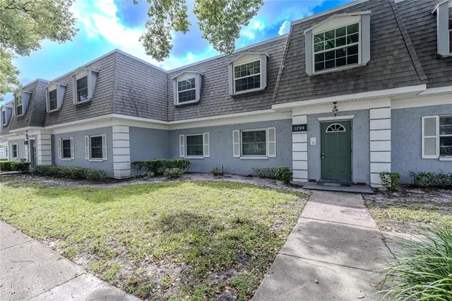 a front view of a house with yard
