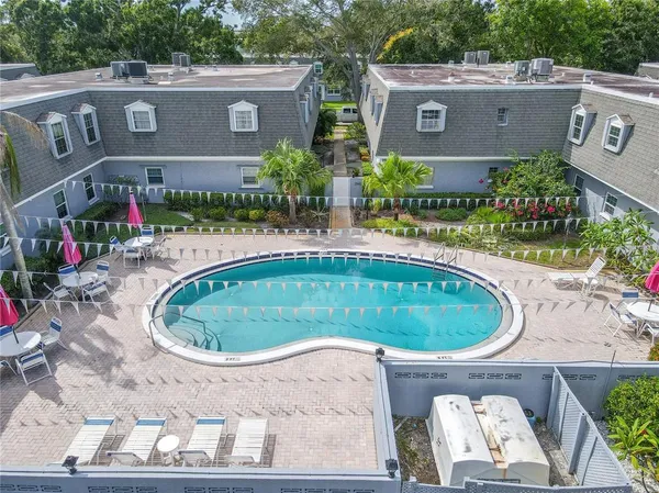 an aerial view of a house with a swimming pool