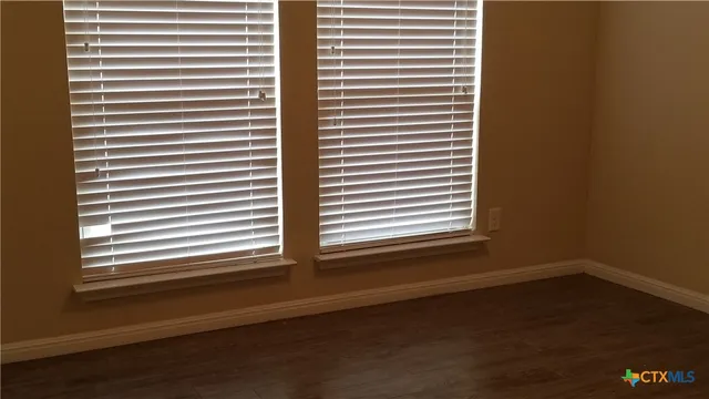 a view of a room that has a window in it