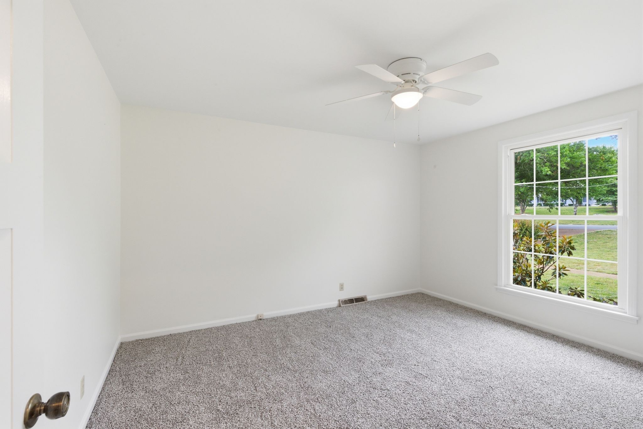 213 Rising Sun Lane Old Hickory, TN 37138 - Photo 23 of 37 an empty room with a window and a ceiling fan