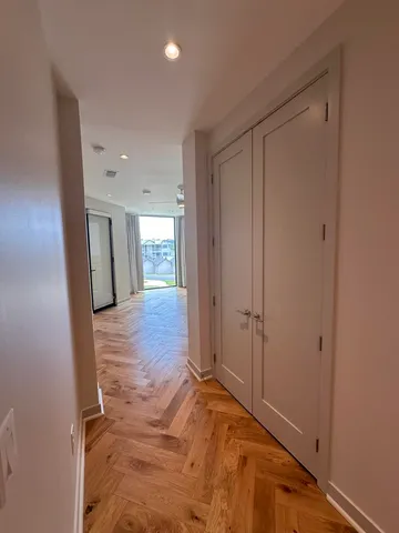 a view of entryway with wooden floor