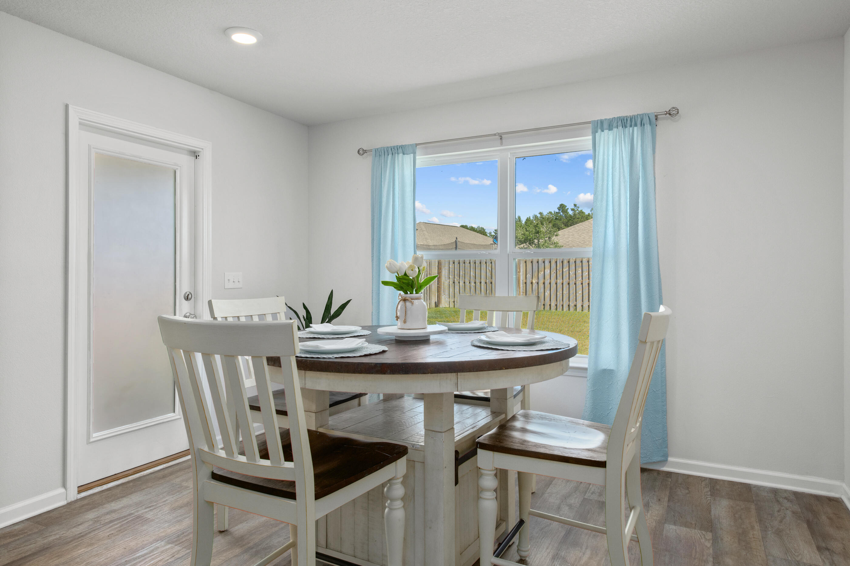 193 This Way Freeport, FL 32439 - Photo 14 of 56 a view of a dining room with furniture and wooden floor
