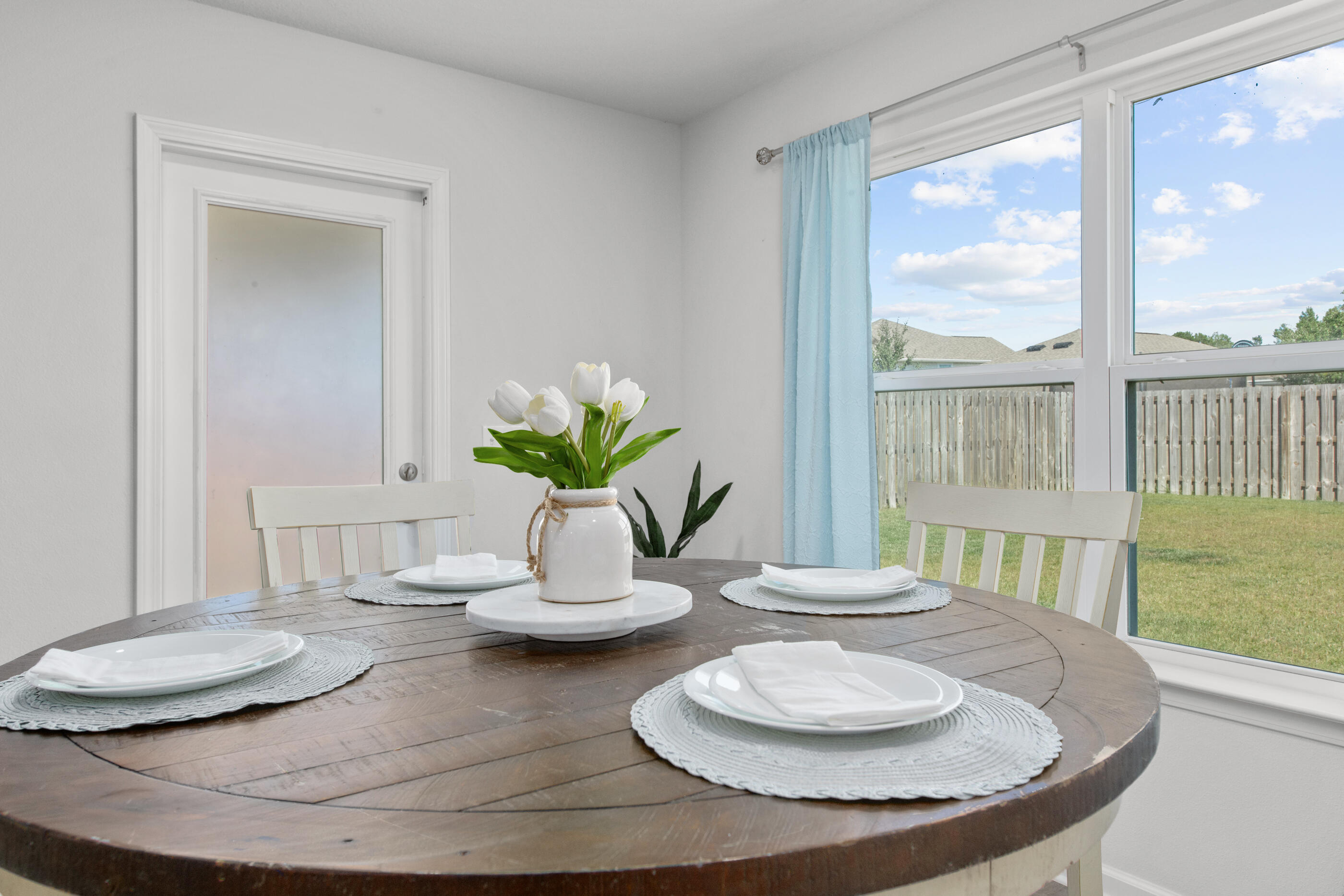 193 This Way Freeport, FL 32439 - Photo 15 of 56 a dining room with furniture and a potted plant