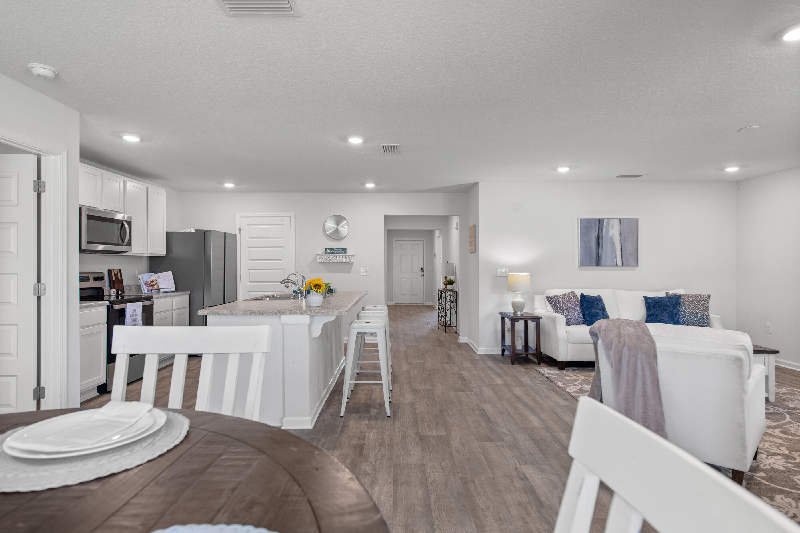 193 This Way Freeport, FL 32439 - Photo 17 of 56 a living room with stainless steel appliances furniture a dining table and chairs