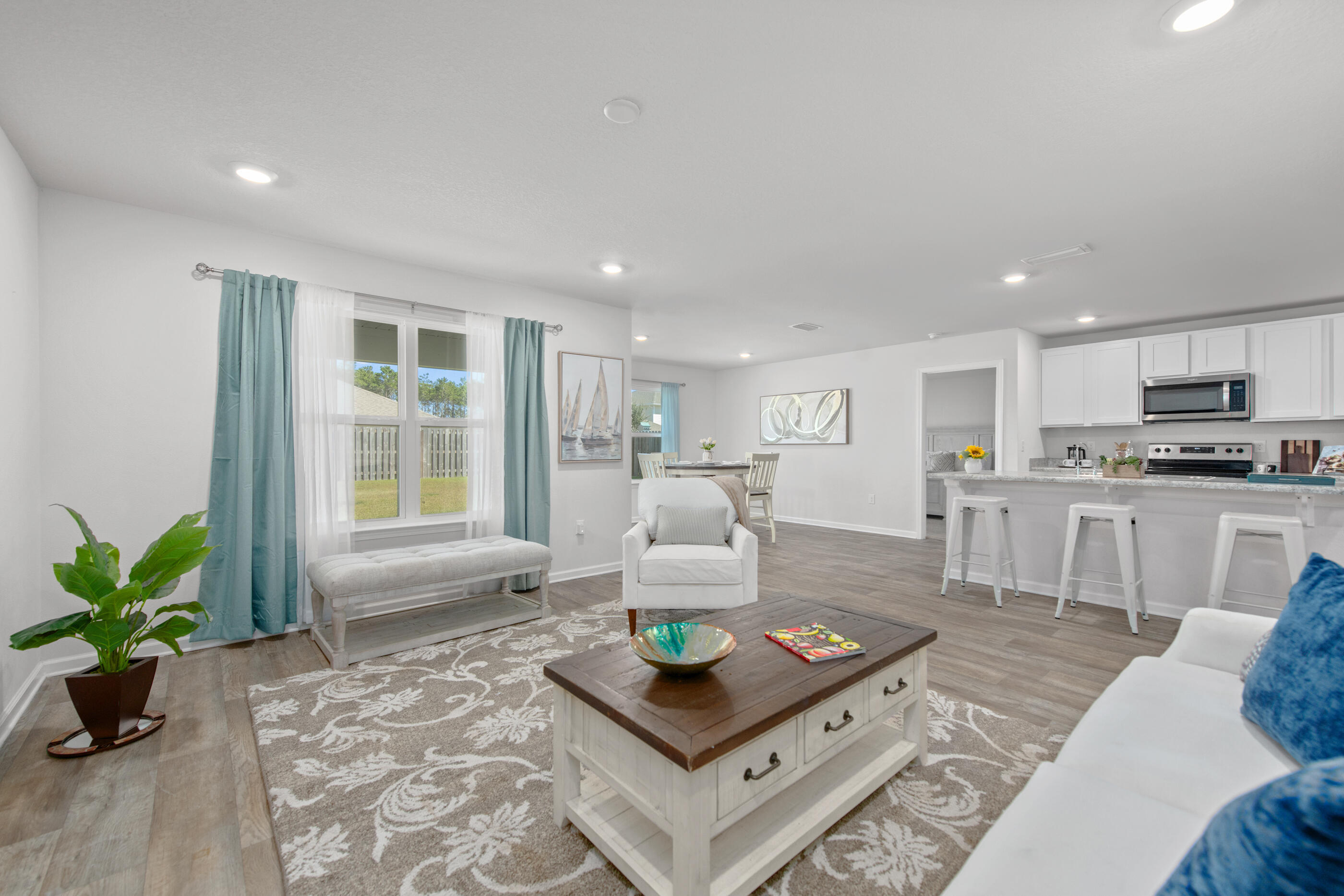 193 This Way Freeport, FL 32439 - Photo 19 of 56 a living room with furniture and a potted plant