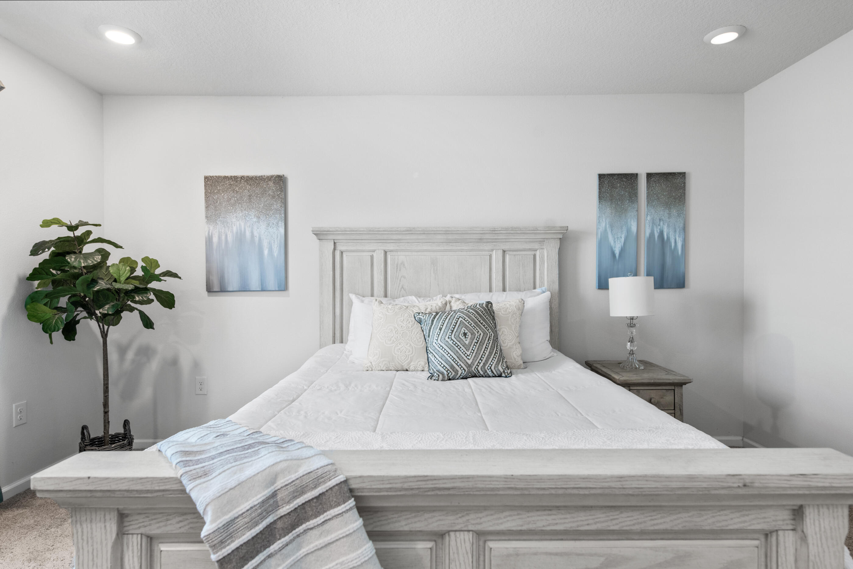 193 This Way Freeport, FL 32439 - Photo 2 of 56 a bedroom with a bed and a potted plant