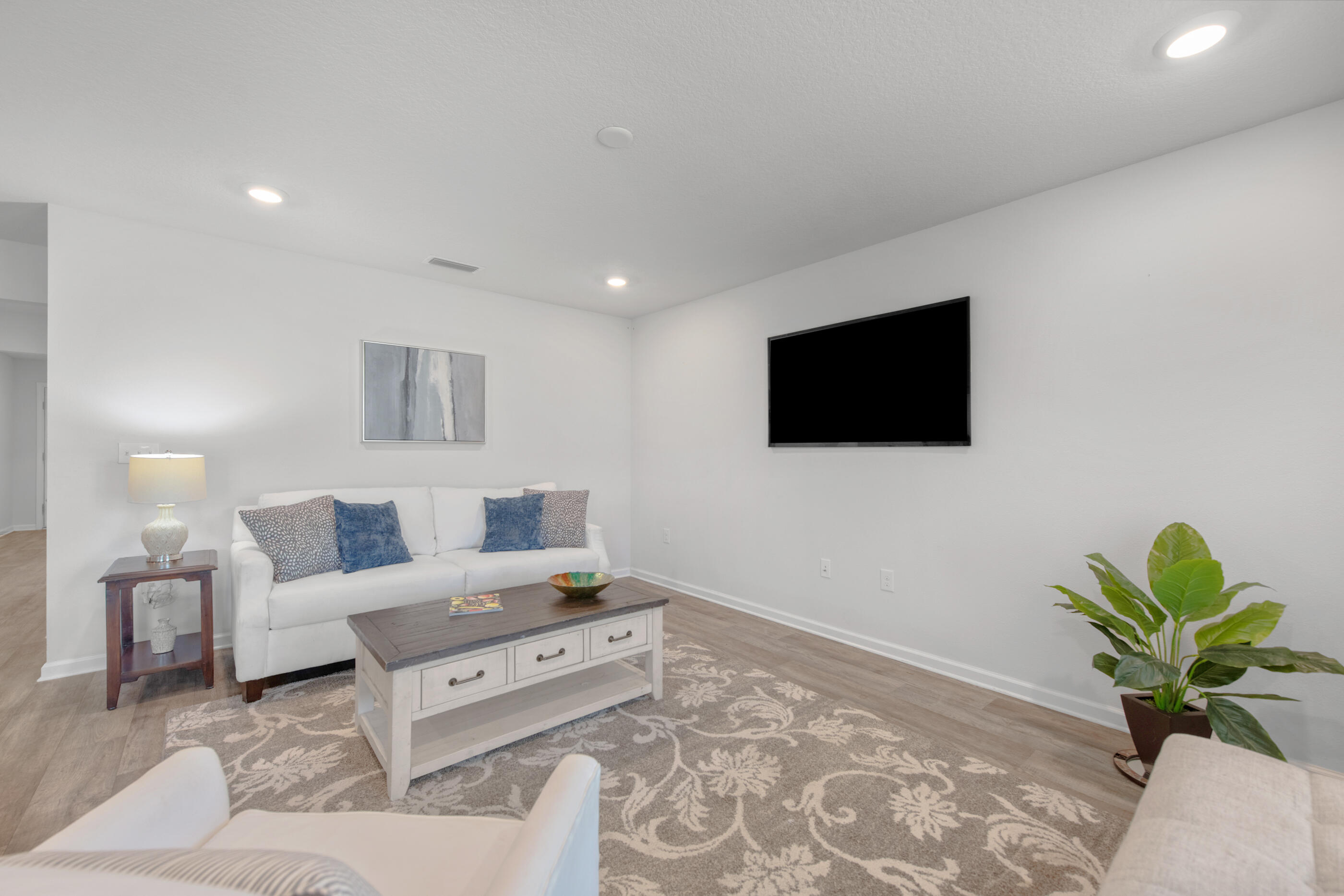 193 This Way Freeport, FL 32439 - Photo 22 of 56 a living room with furniture and a flat screen tv