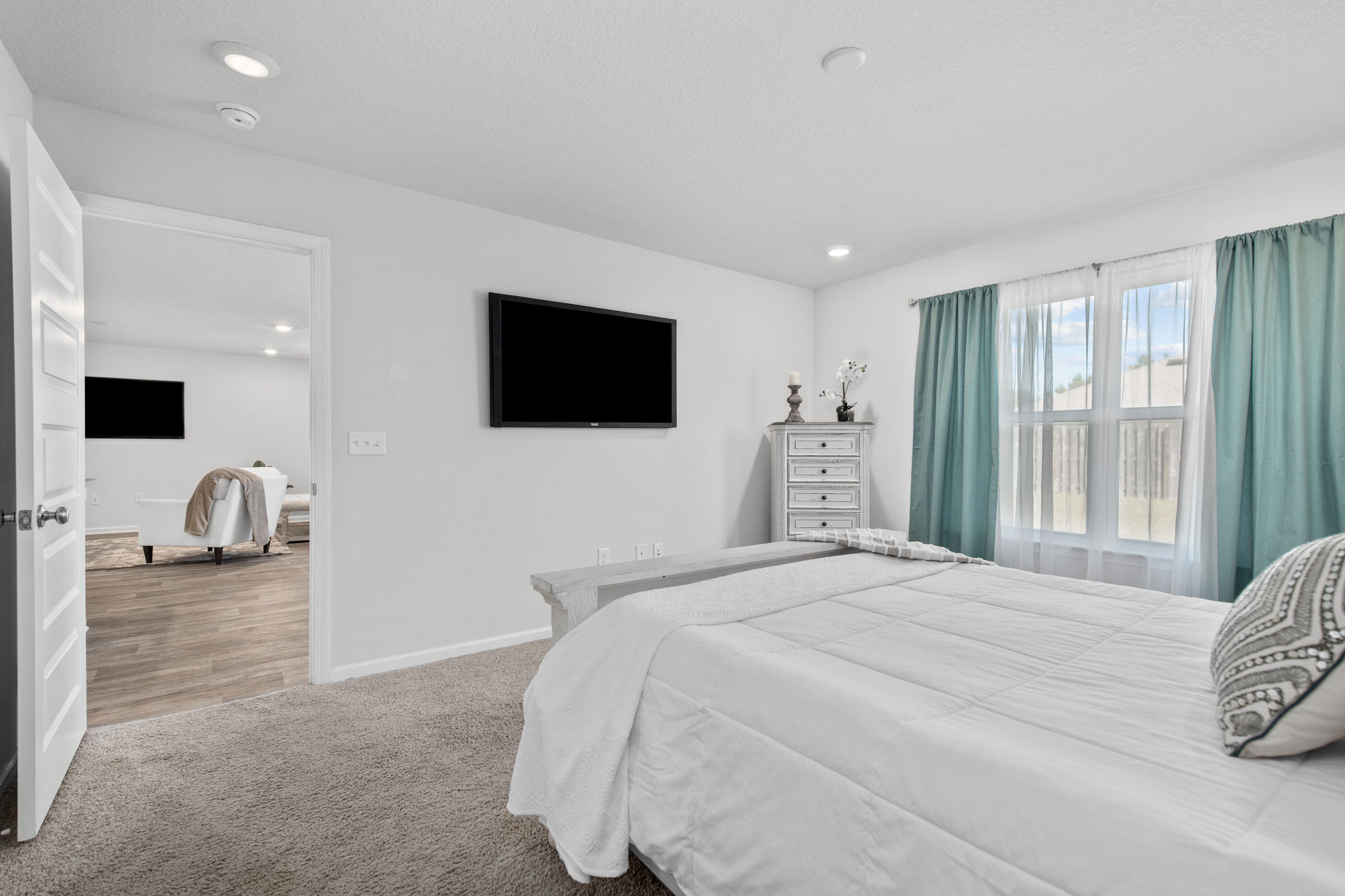 193 This Way Freeport, FL 32439 - Photo 25 of 56 a bedroom with a bed a television and a large window