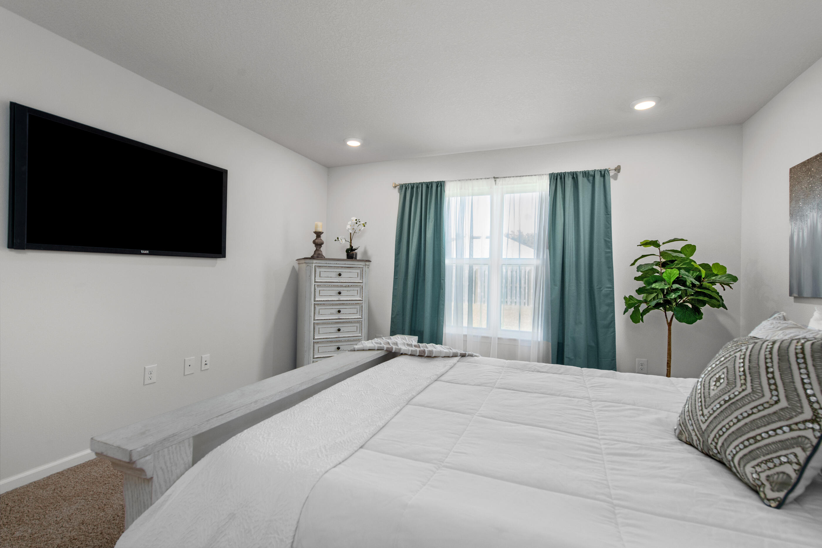 193 This Way Freeport, FL 32439 - Photo 26 of 56 a bedroom with a bed and a flat screen tv