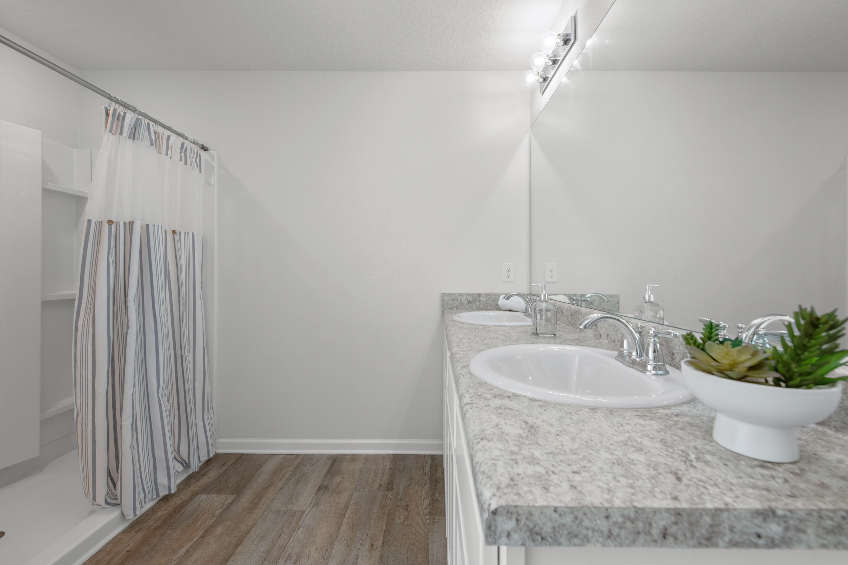 193 This Way Freeport, FL 32439 - Photo 27 of 56 a bathroom with a sink toilet and shower