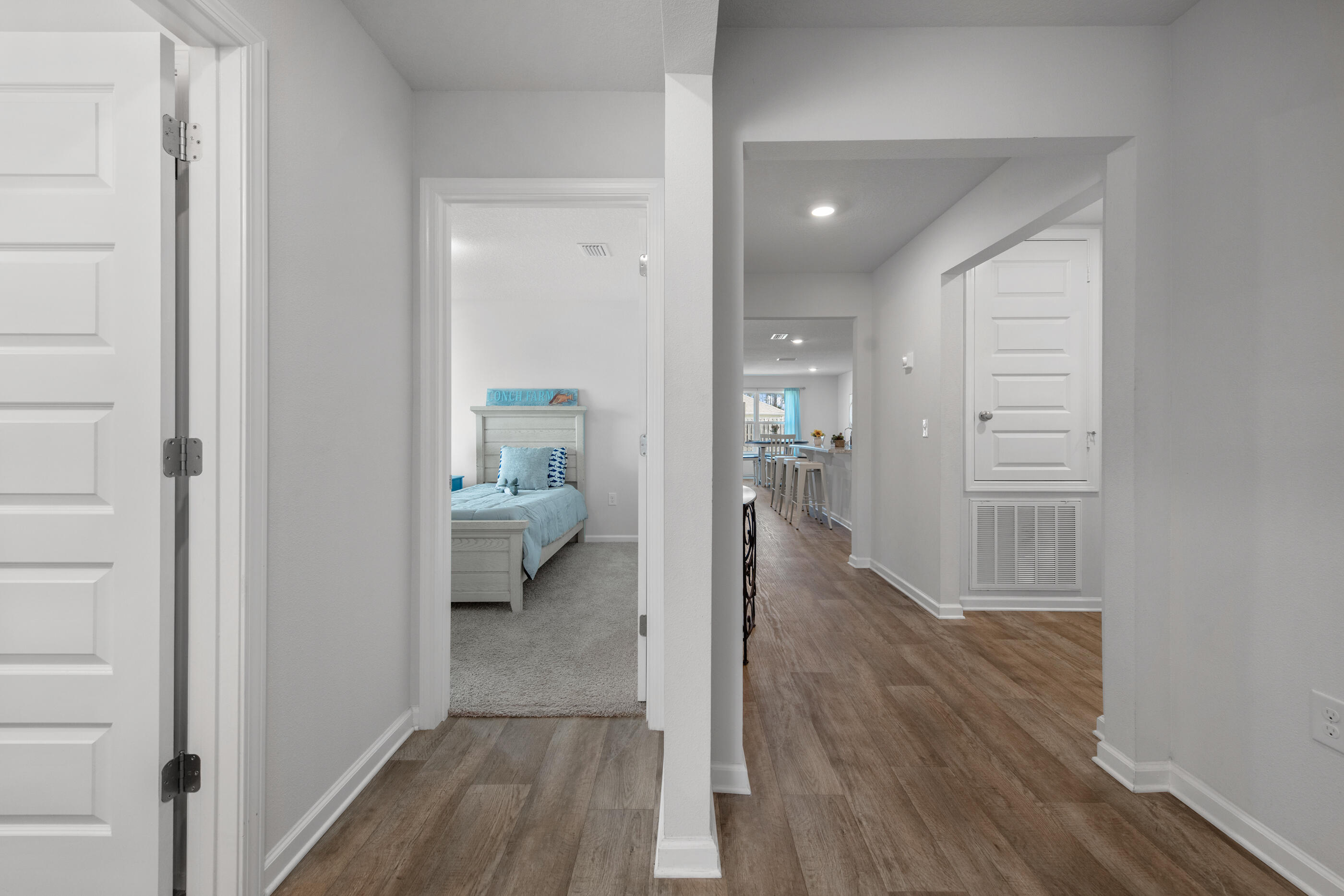 193 This Way Freeport, FL 32439 - Photo 32 of 56 a view of hallway with wooden floor