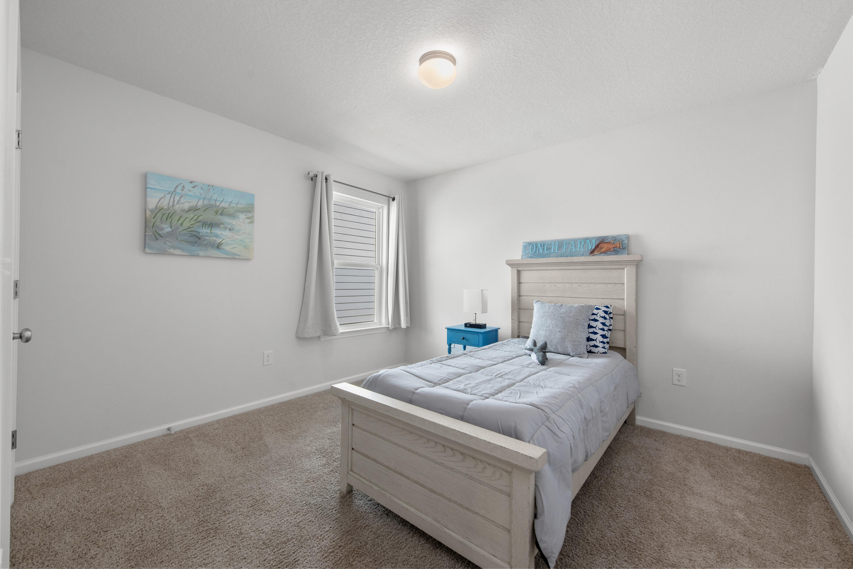 193 This Way Freeport, FL 32439 - Photo 33 of 56 a bedroom with a bed and a window