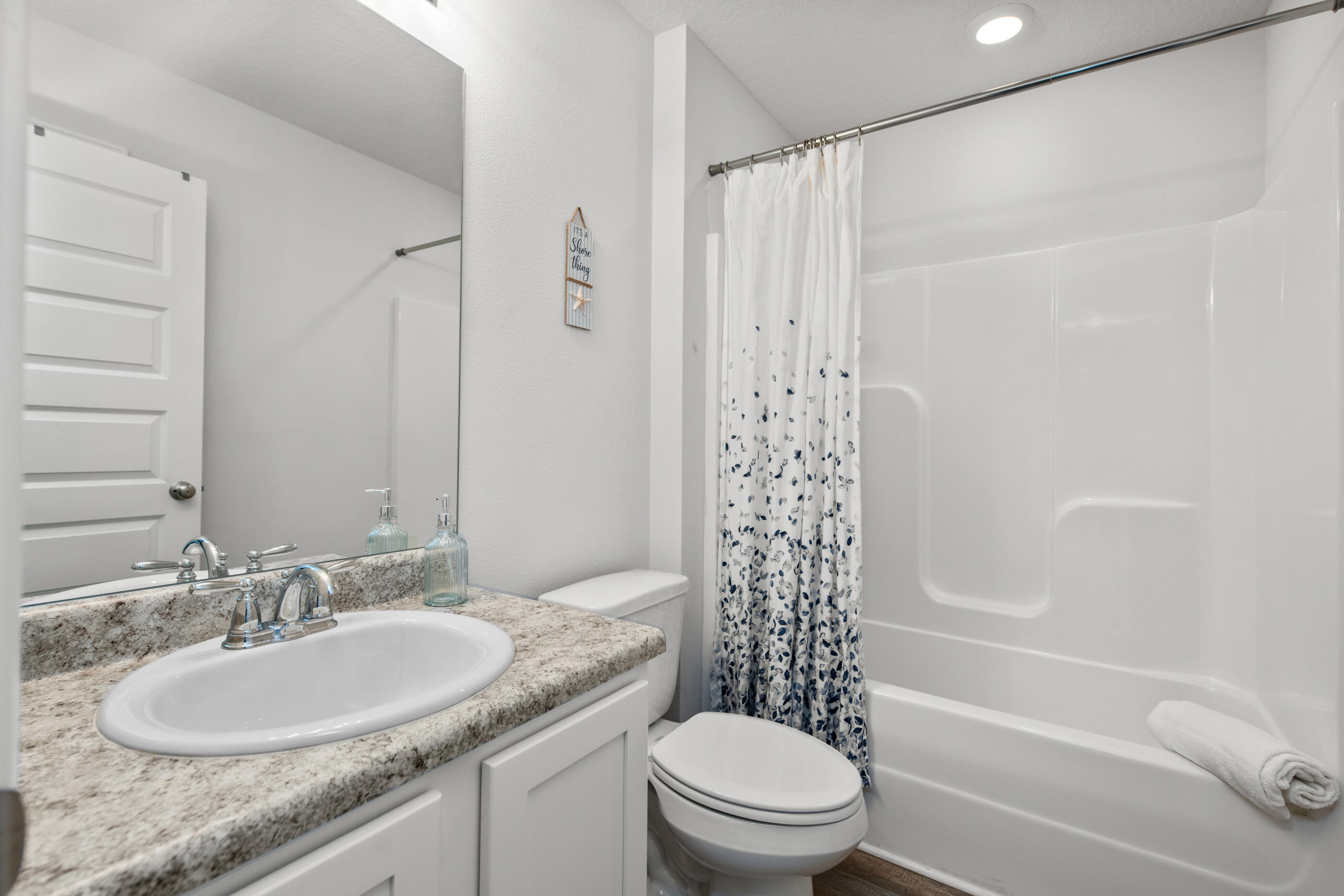 193 This Way Freeport, FL 32439 - Photo 36 of 56 a bathroom with a granite countertop sink toilet and shower