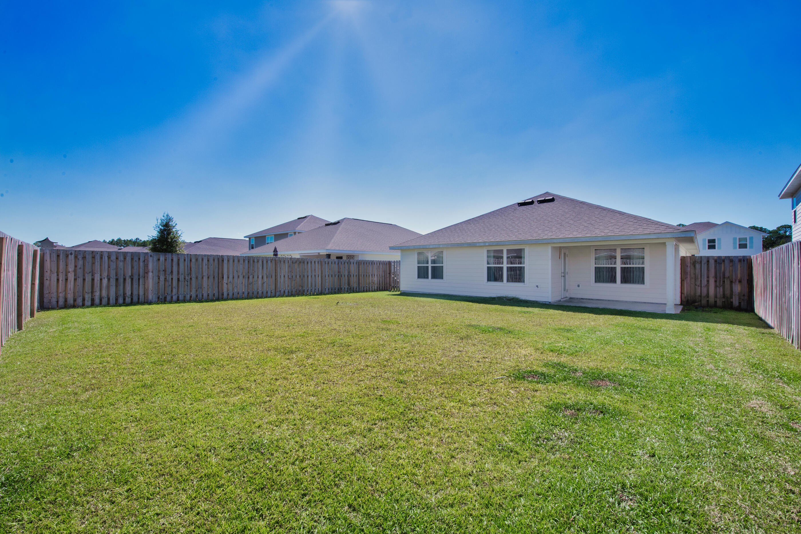 193 This Way Freeport, FL 32439 - Photo 41 of 56 a front view of a house with garden