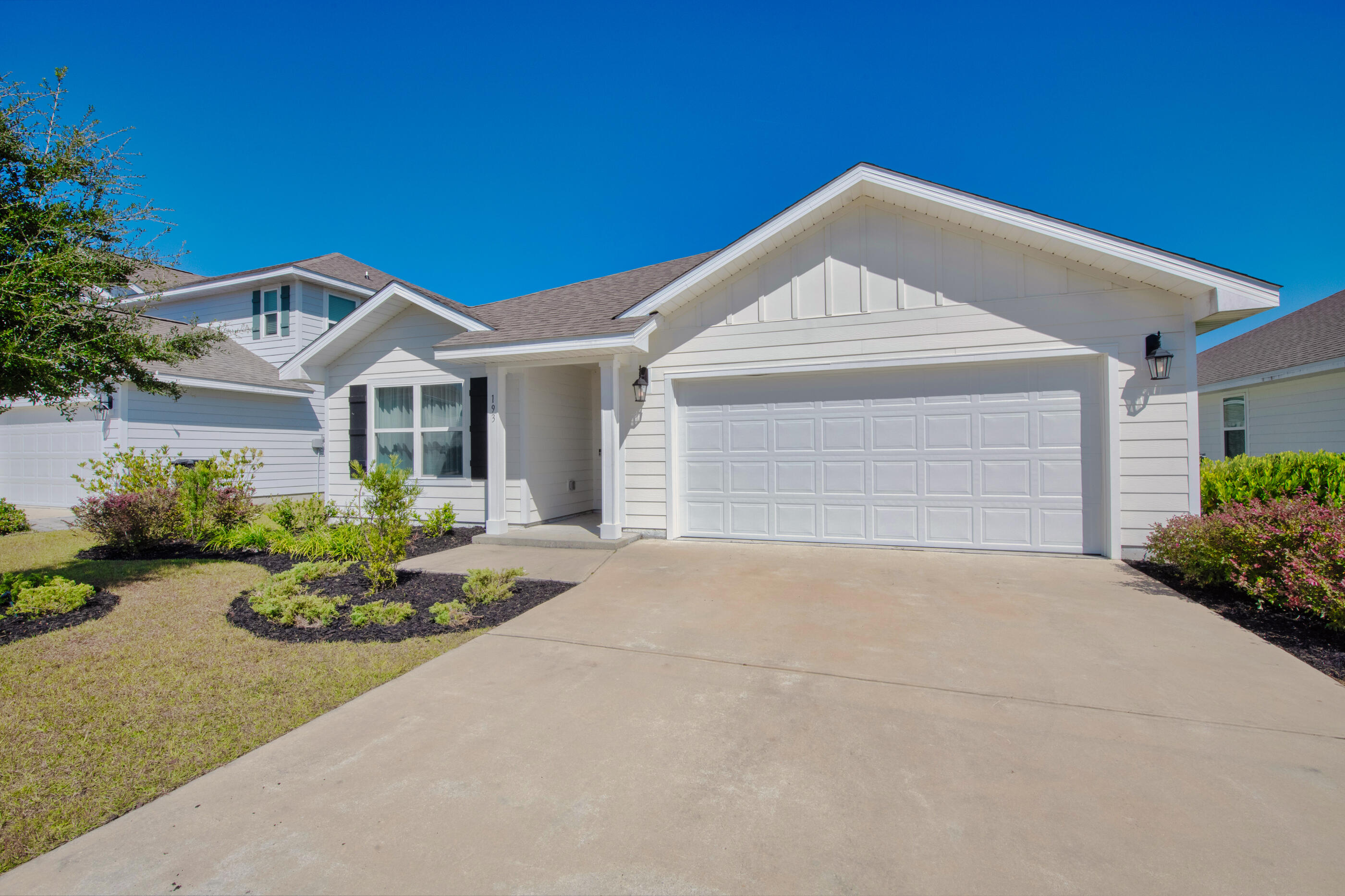 193 This Way Freeport, FL 32439 - Photo 42 of 56 a front view of a house with a yard