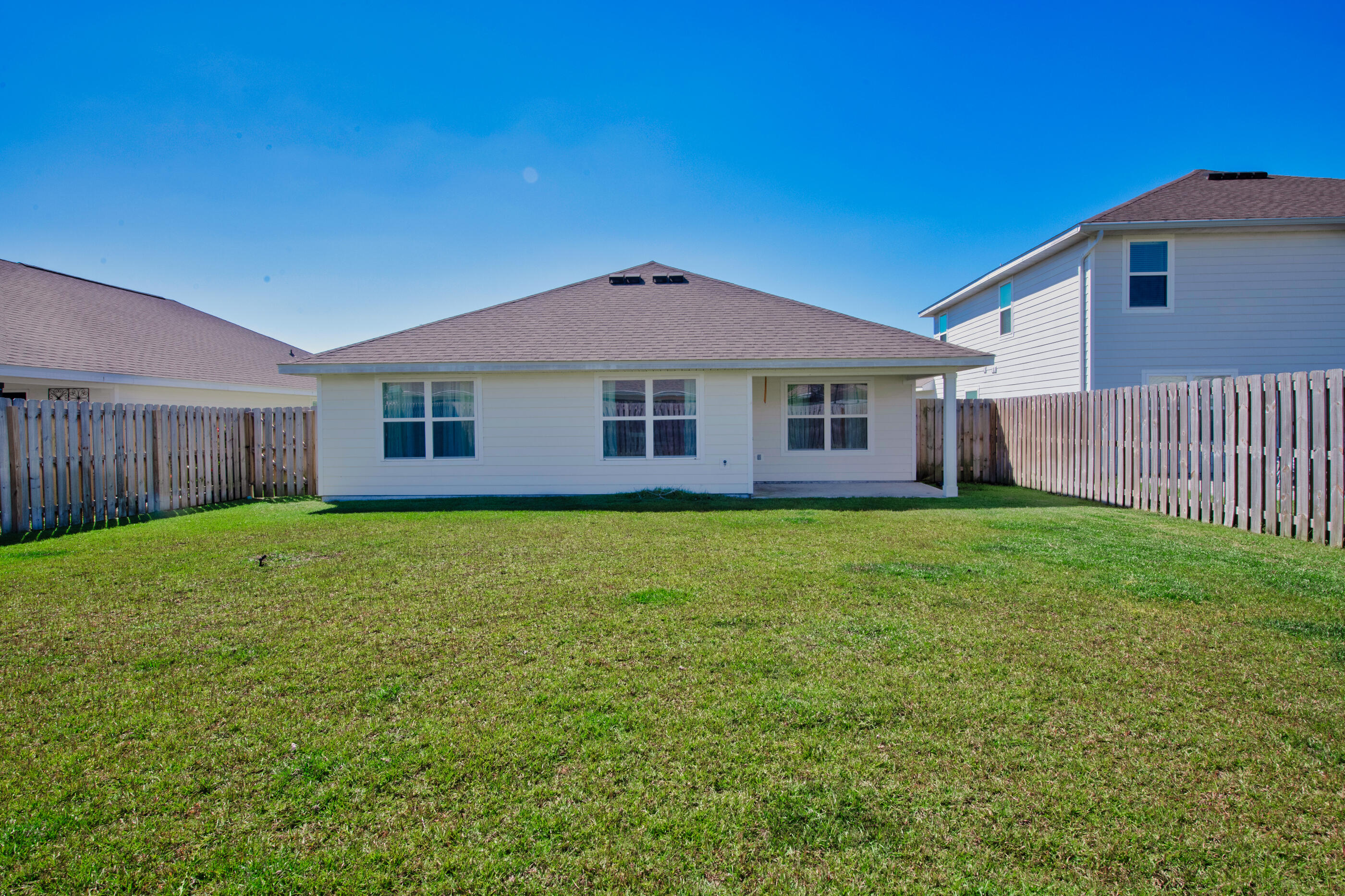 193 This Way Freeport, FL 32439 - Photo 43 of 56 a front view of a house with a garden