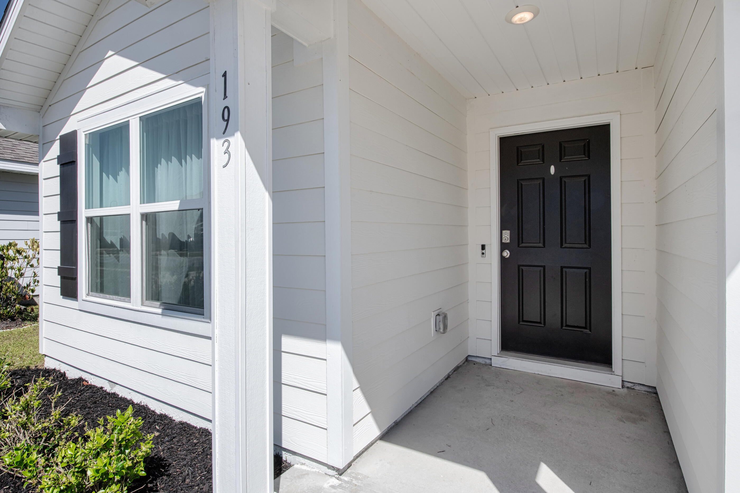 193 This Way Freeport, FL 32439 - Photo 4 of 56 front view of a house with a window