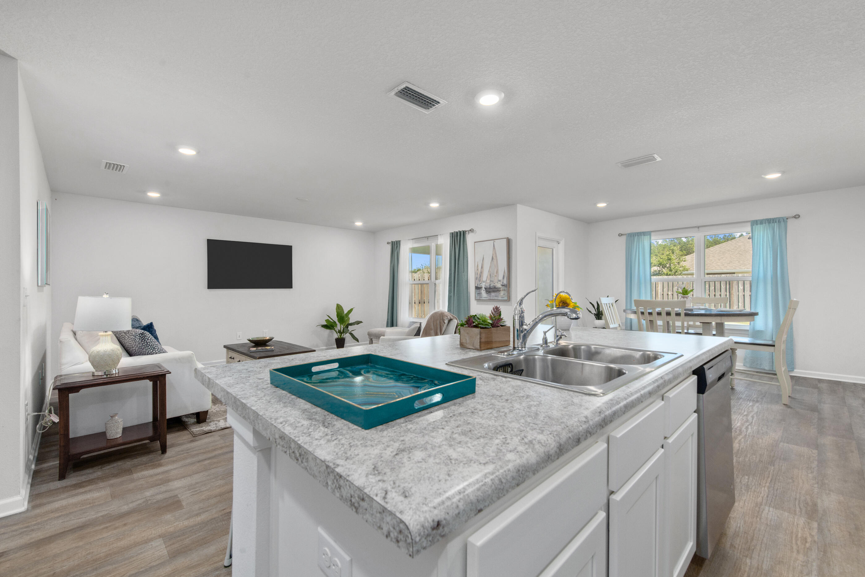 193 This Way Freeport, FL 32439 - Photo 7 of 56 a kitchen with stainless steel appliances granite countertop a sink and a refrigerator