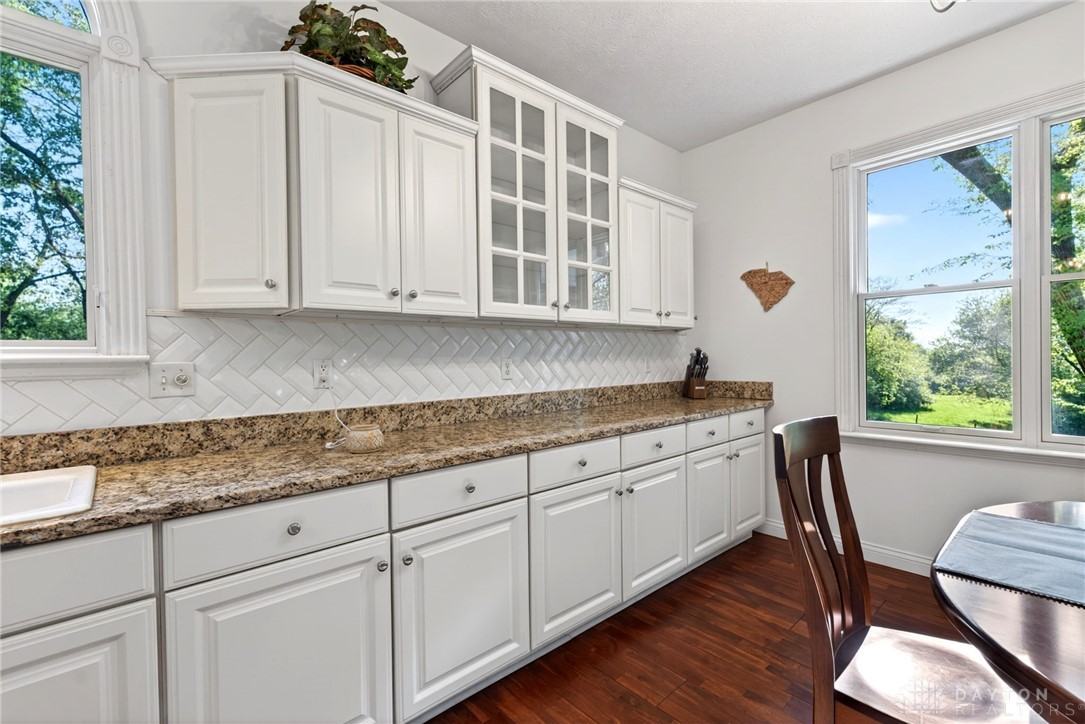 330 South Alpha Bellbrook Road Bellbrook, OH 45305 - Photo 28 of 87 Bright and airy, this kitchen features rich hardwood flooring and sleek countertops.