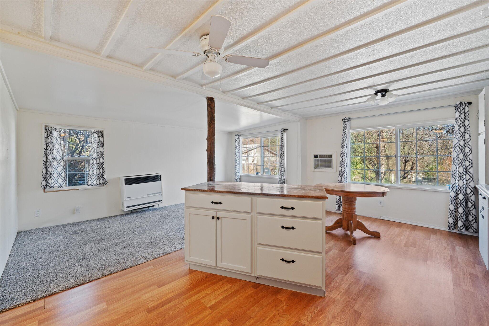 3150 Haley Lane Redding, CA 96003 - Photo 9 of 23 a view of a workspace with furniture and a window