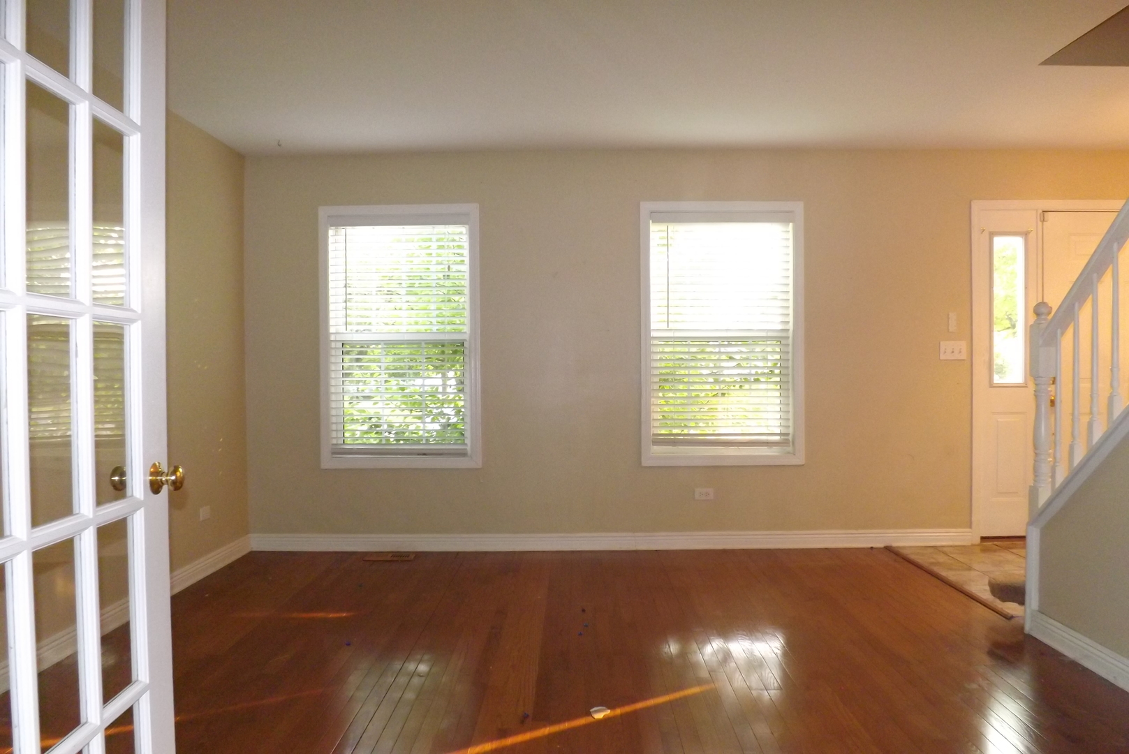2325 Caton Corner Plainfield, IL 60586 - Photo 5 of 11 a view of an empty room with wooden floor and a window
