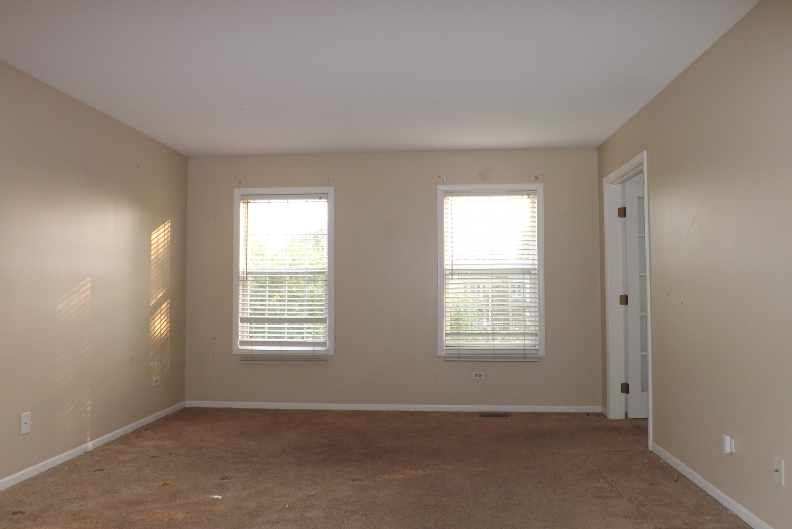 2325 Caton Corner Plainfield, IL 60586 - Photo 8 of 11 an empty room with windows