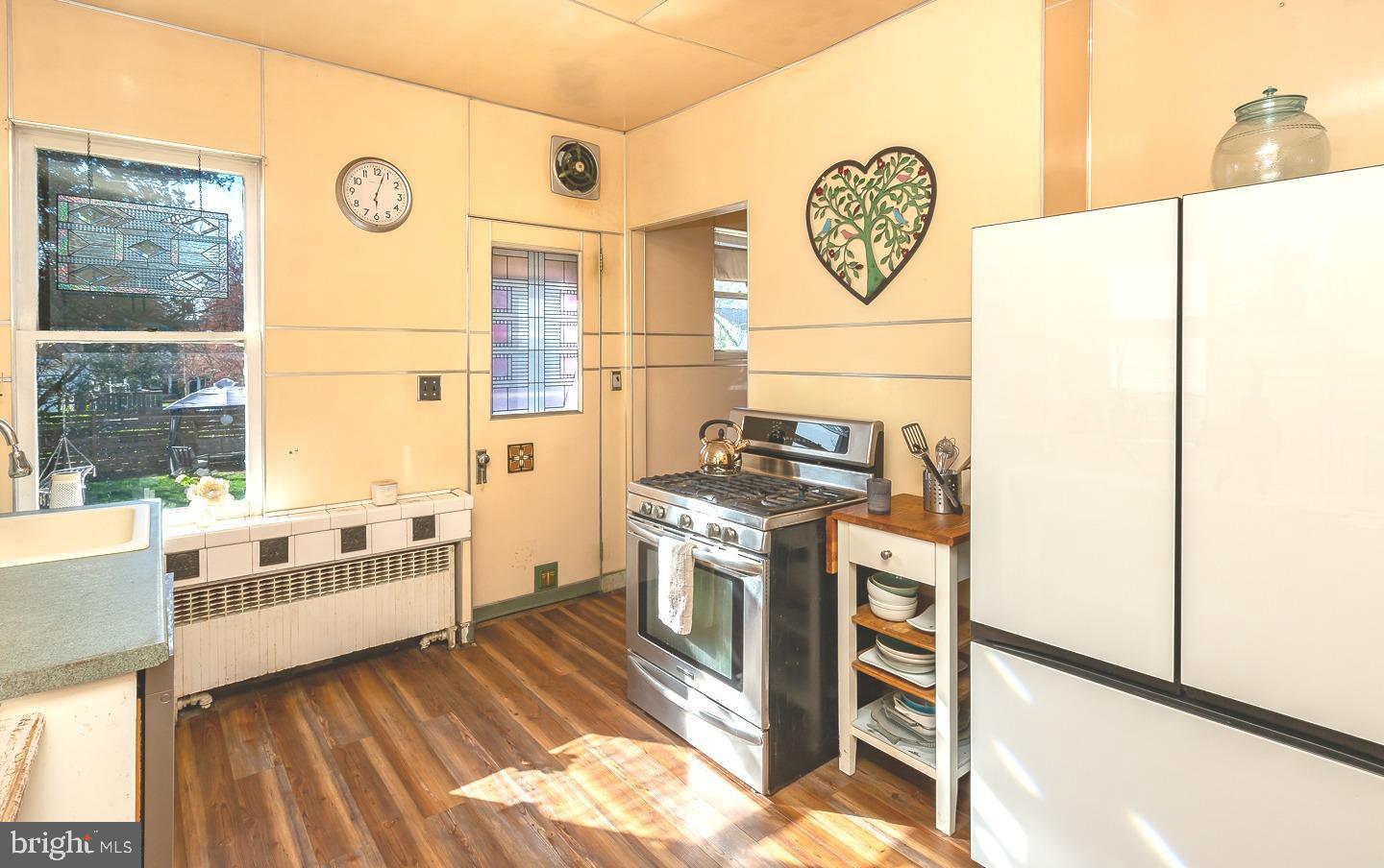 251 Sagamore Road Havertown, PA 19083 - Photo 15 of 41 a kitchen with a stove a sink and a refrigerator