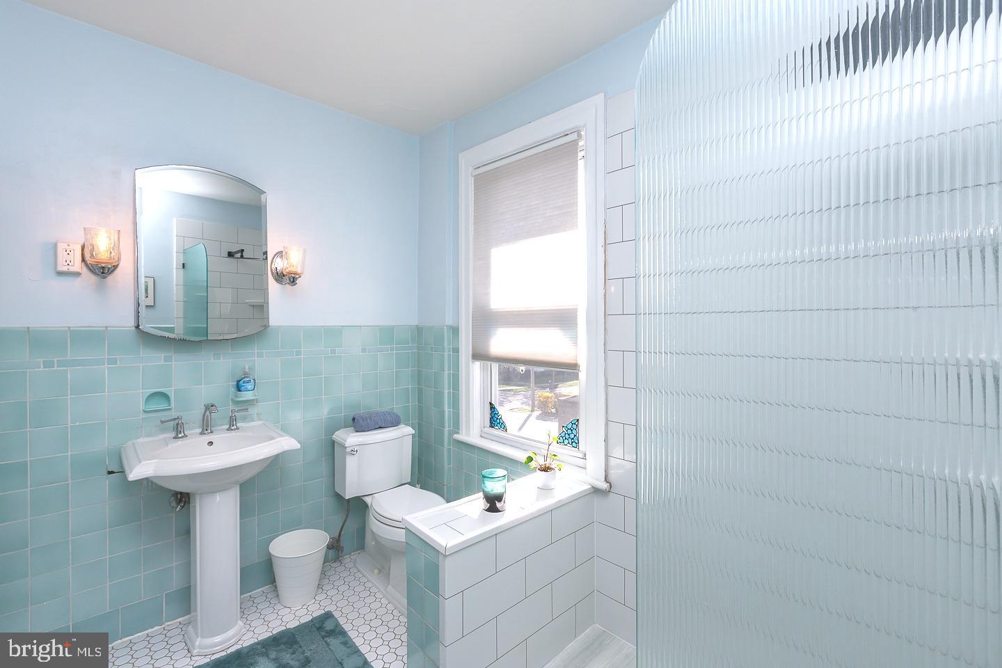 251 Sagamore Road Havertown, PA 19083 - Photo 23 of 41 a bathroom with a sink toilet and mirror