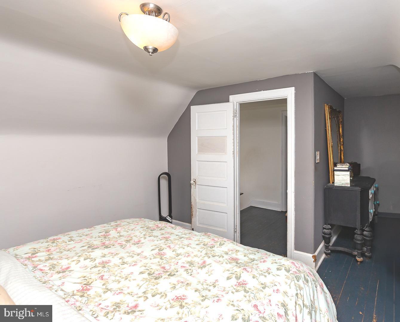 251 Sagamore Road Havertown, PA 19083 - Photo 26 of 41 a bedroom with a bed and a chandelier