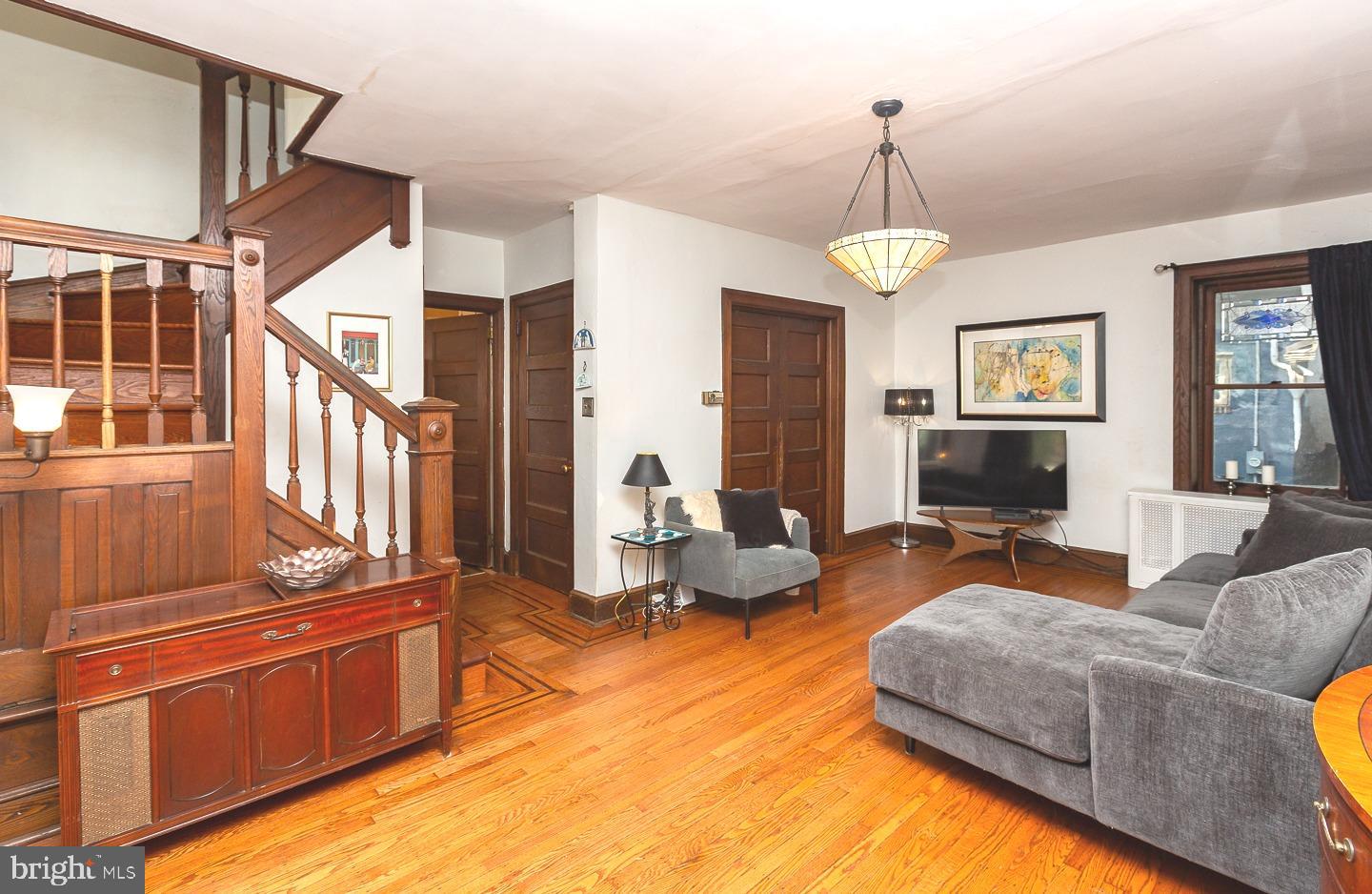 251 Sagamore Road Havertown, PA 19083 - Photo 4 of 41 a living room with furniture oven and a chandelier