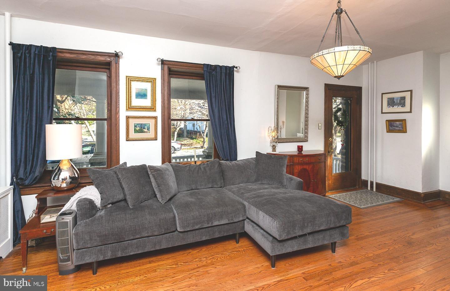 251 Sagamore Road Havertown, PA 19083 - Photo 8 of 41 a living room with furniture and a chandelier