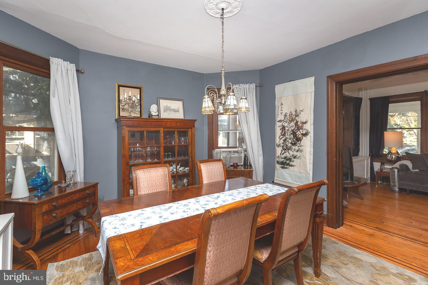 251 Sagamore Road Havertown, PA 19083 - Photo 10 of 41 a dining room with furniture a chandelier and wooden floor
