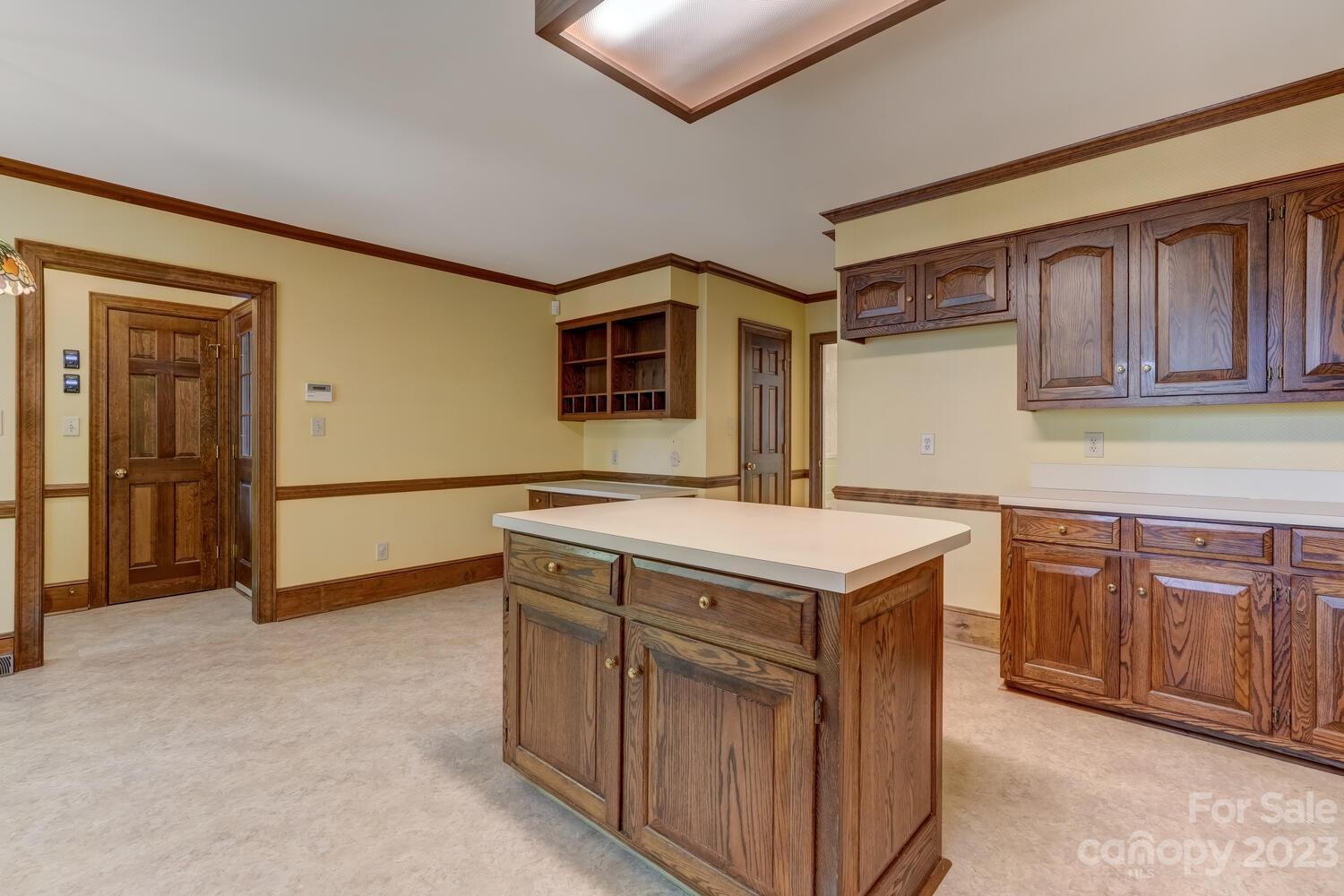 10215 Hanover Glen Road Charlotte, NC 28210 - Photo 13 of 40 a kitchen with a stove and a cabinets