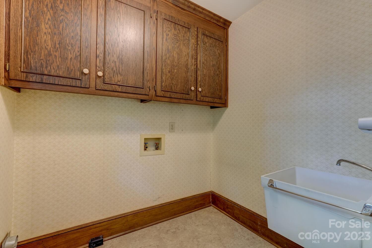 10215 Hanover Glen Road Charlotte, NC 28210 - Photo 19 of 40 a view of storage and utility room with racks on the wall