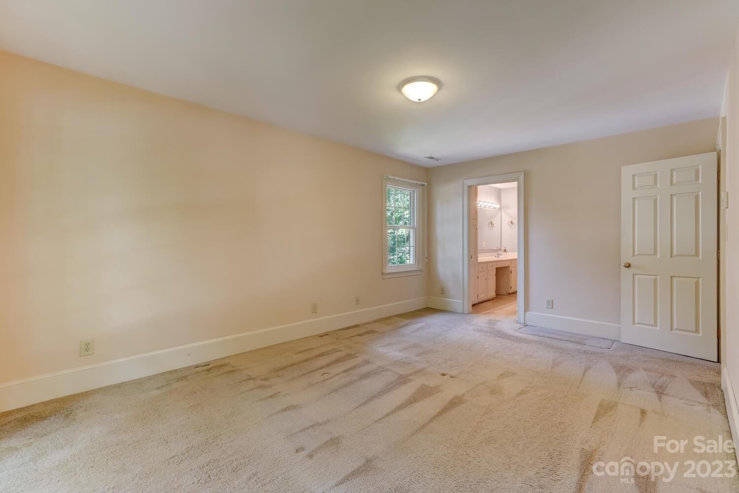 10215 Hanover Glen Road Charlotte, NC 28210 - Photo 22 of 40 an empty room with windows and closet