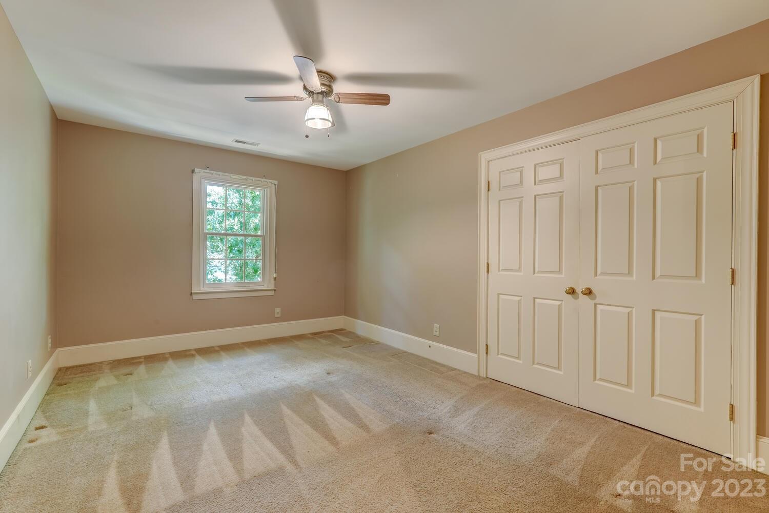 10215 Hanover Glen Road Charlotte, NC 28210 - Photo 27 of 40 a view of an empty room with a window