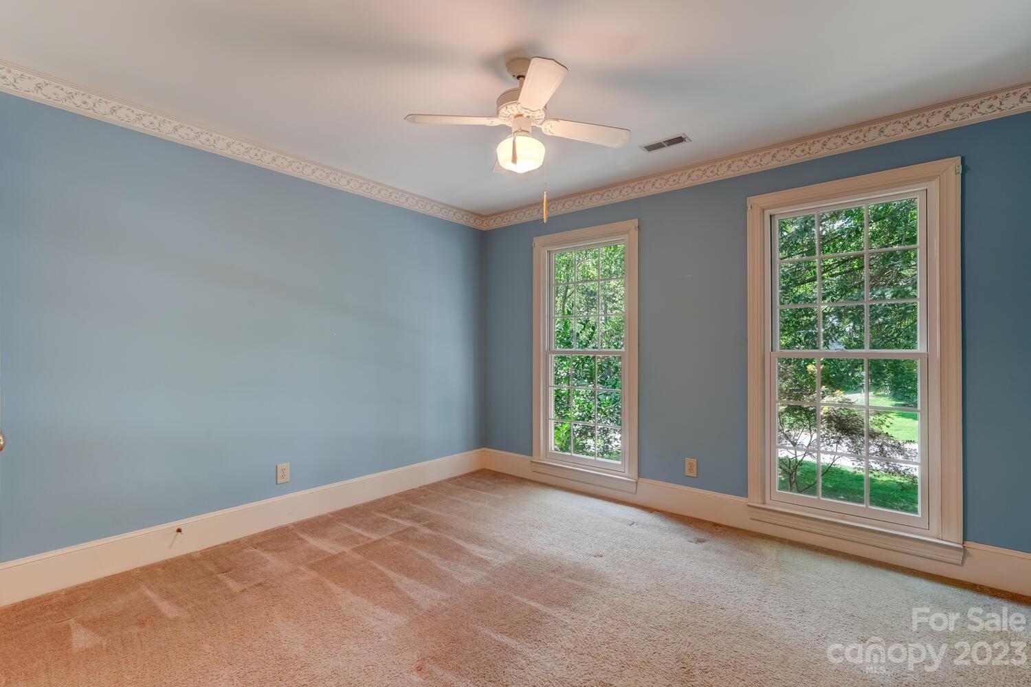 10215 Hanover Glen Road Charlotte, NC 28210 - Photo 28 of 40 a view of an empty room with a window