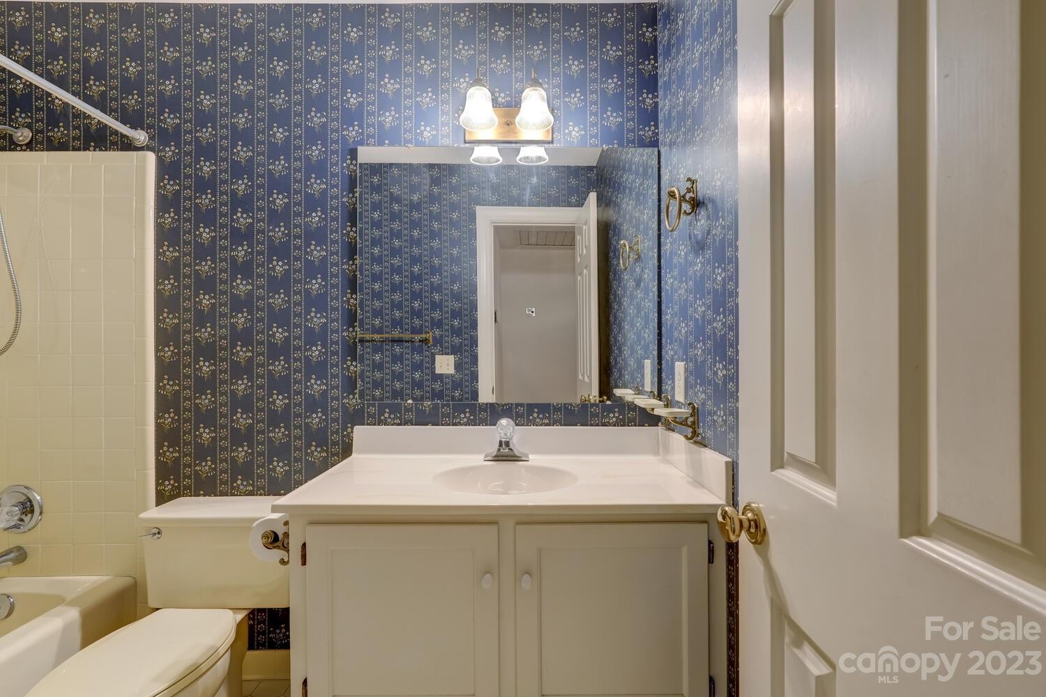 10215 Hanover Glen Road Charlotte, NC 28210 - Photo 30 of 40 a bathroom with a sink and a mirror
